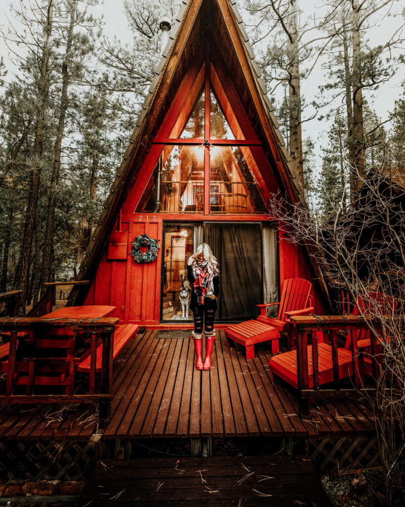 Red A-Frame Cabin with Girl in Hunter Red Boots Big Bear Rental California