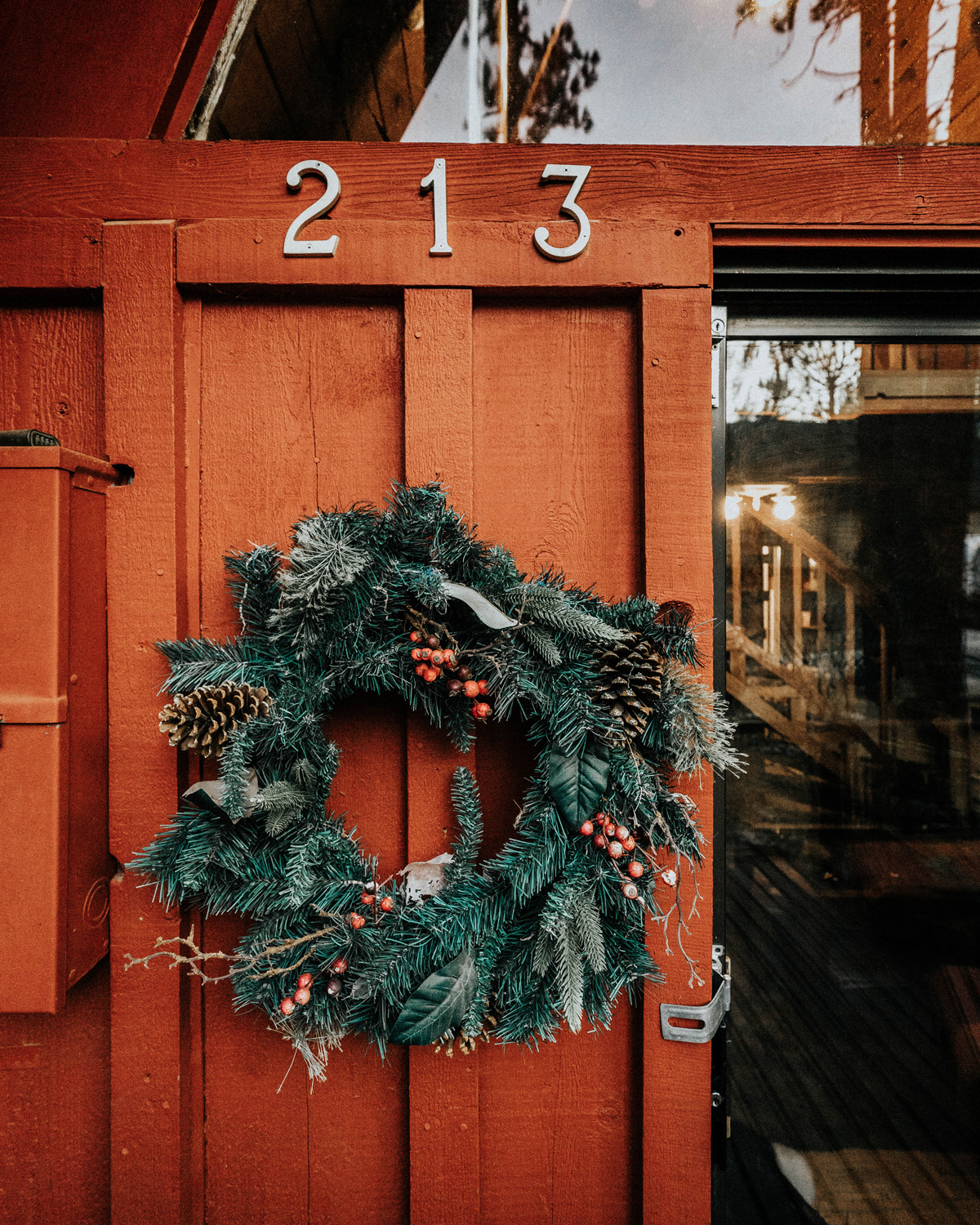 Cute wreath on door of cabin for the holidays