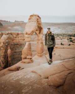 Girl Hiking at Delicate Arch in Moab Utah