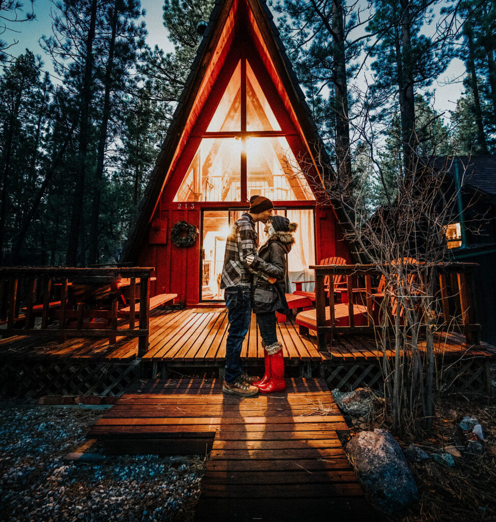 Big Bear Rental Cabin Red A-Frame Girl in Red Hunter Boots