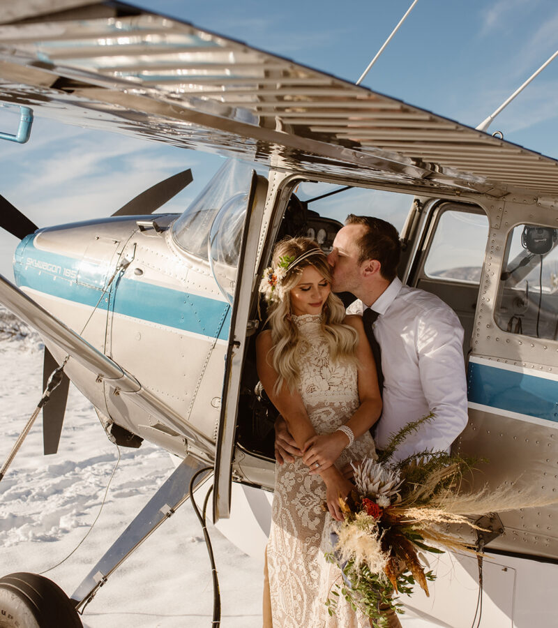 couple photo airplane in the snow